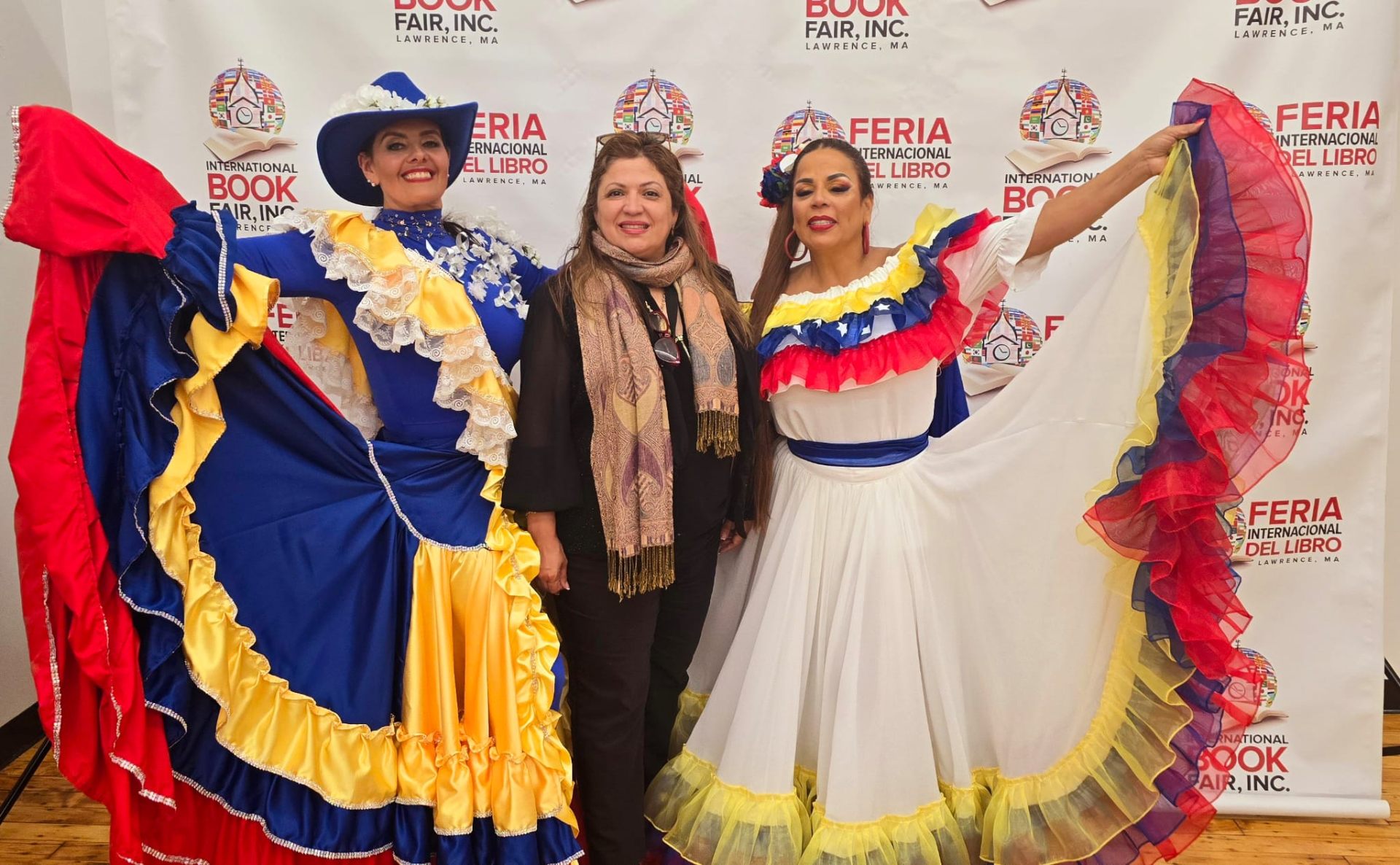 Folk dancers in traditional Venezuelan dresses at a cultural event